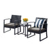 Zweier-Set schwarze Gartenstühle mit grauen Sitzkissen und ein kleiner schwarzer Beistelltisch mit Vase und Sonnenblumen im Online Möbelshop
