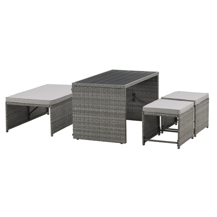 Graues Gartenmöbel-Set aus Rattan mit ausziehbarem Tisch und gepolsterten Sitzbänken
