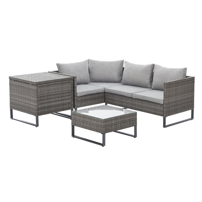 Graue Polyrattan Gartenlounge Stellmöglichkeit Ecksofa mit Kissenbox daneben und Tisch