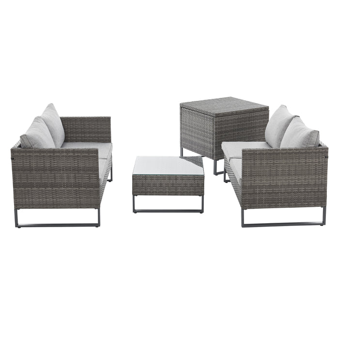 Graue Polyrattan Gartenlounge Stellmöglichkeit Bänke gegenüber und Kissenbox daneben