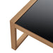 Eckbild Tisch mit schwarzer Glasplatte